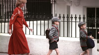 Princess Diana walking with a young William and Harry