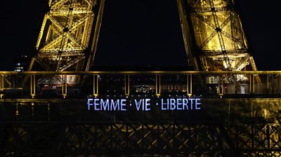 Eiffel Tower with the words "Femme, Vie, Liberte"