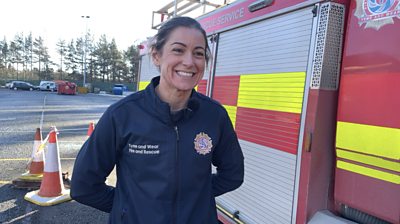 Crew Manager Sarah stood beside a fire engine
