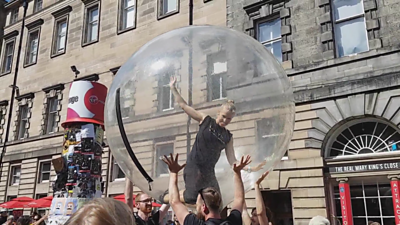  Woman inside a giant bubble