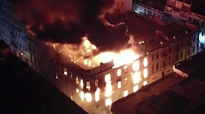 A building in Lima, Peru on fire during anti-government protests