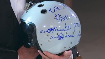 Lindsay Hoyle holds a fighter pilot's helmet