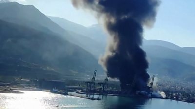 Thick black plumes of smoke rise from burning Turkish port