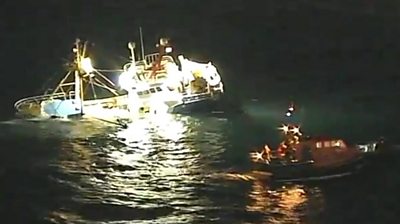 The crew of a Belgian fishing vessel that struck rocks and sank off Cornwall have been reported "safe and well", HM Coastguard has said.