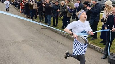 Eloise Kramer crosses Olney pancake race finish line