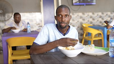 A man eating at a local eatery