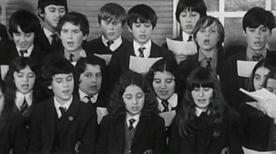 Archive footage of a children's choir