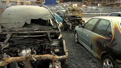 Two of the fire-damaged cars