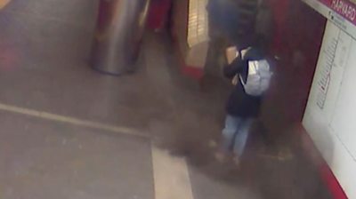 Commuter standing next to fallen panel at a subway station in Massachusetts