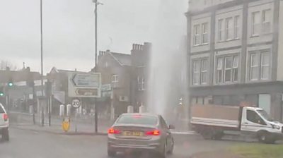 Car driving past a geyser in Charlton