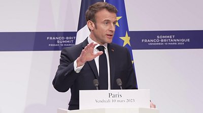 President Macron speaking at a news conference