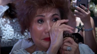 Michelle Yeoh's mother, Janet, wiping a tear from her eye