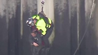 Firefighter rescues man from river