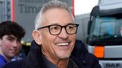 Gary Lineker smiling as he arrives at the Etihad stadium for the football
