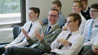 Elder Cook laughing with others in Missionary Training Centre session in Chorley