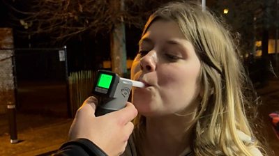A youngster being breathalysed