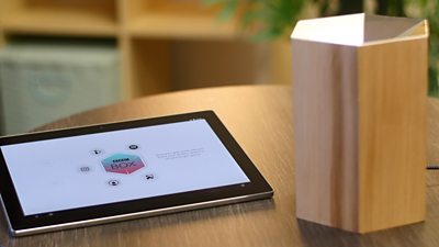 A tablet and the 'bbc box' on a table