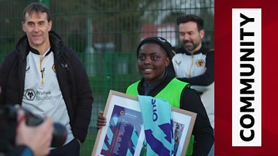 Wolves manager Julen Lopetegui presents a framed picture to a young fan