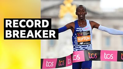 Kelvin Kiptum celebrates setting a London Marathon record as he crosses the line to win the men's race at the London Marathon