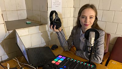 Liudmyla Tiahnyriadno in a temporary Ukrainian Radio studio in a bunker in Lviv, early in the war. Photo courtesy of Liudmyla Tiahnyriadno.