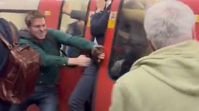 Man tries to pry open Tube doors for panicked passengers stuck inside carriage.