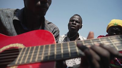 Person playing the guitar