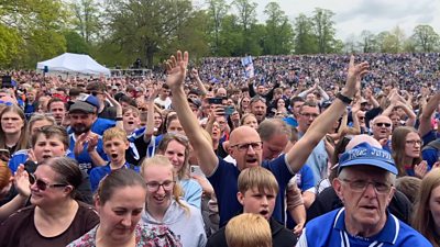 Players, staff and fans come together to mark the club's promotion to the Championship.