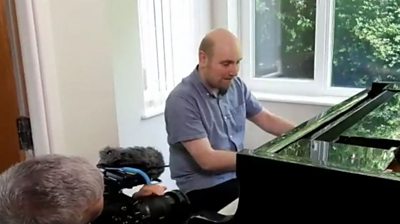 Matthew Richards playing the piano