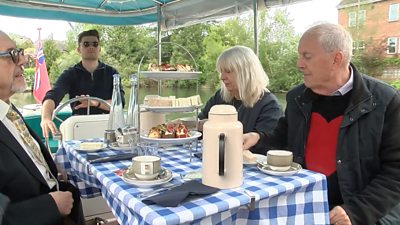 A tea party taking place on a boat