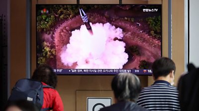 Satellite launch on TV in Seoul