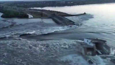 Water gushes through damaged dam