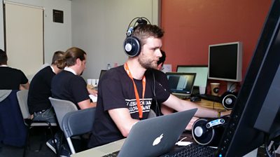 Man in headphones on computer