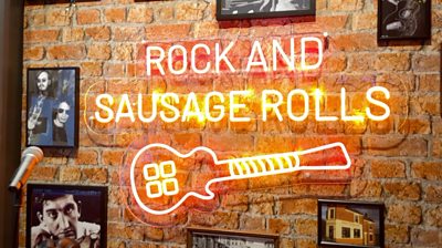 Rock and sausage rolls neon sign