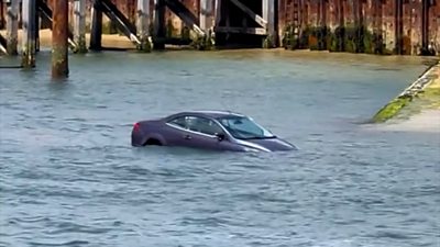 Car floating in the sea off Sandbanks