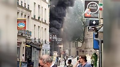 Smoke billowing out of building on Paris street
