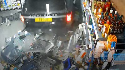 Range Rover crashes into shop