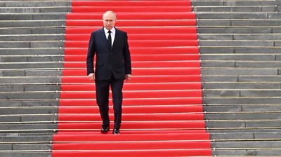 Vladimir Putin on red carpet in Cathedral Square