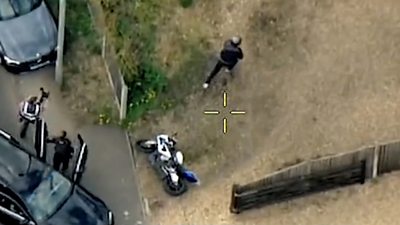 Aerial view of police chasing a motorcyclist