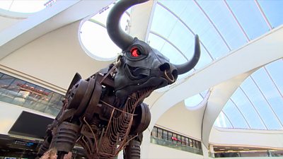 Ozzy the bull in his new home at New Street Station