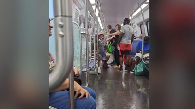 Metro rider captures water pounding inside train car - BBC News