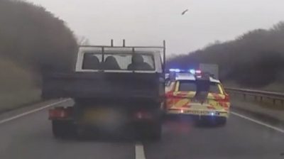 Dangerous driver rams police car off the road