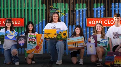 Young people in front of the 'peace gate'