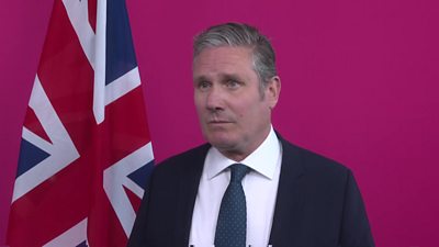 Sir Keir Starmer infront of Union Jack flag