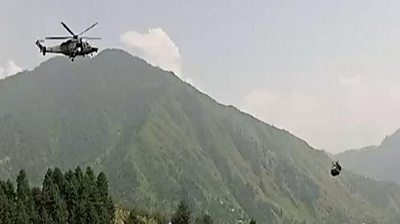 Helicopter hovers near Pakistan cable car