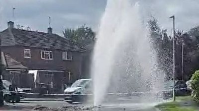Water pours from a burst main on Liverpool Road, Worcester