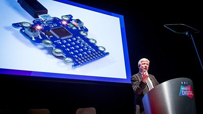 Tony Hall delivers a presentation about the tv Microbit in his hand