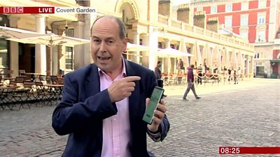 Rory Cellan-Jones in Covent Garden with a 5G phone