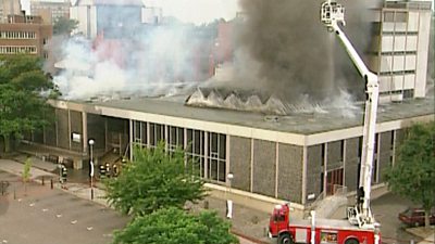 Norwich Library burns during a fire in 1994
