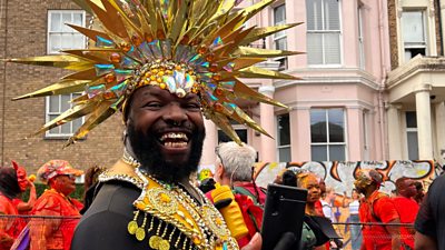 A man in costume smiling