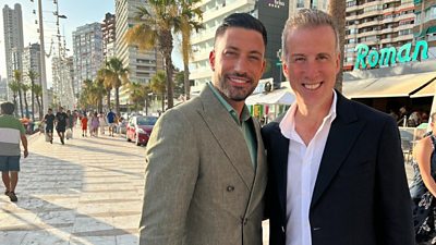 Anton Du Beke and Giovanni Pernice standing and smiling at the camera on a pavement in Spain